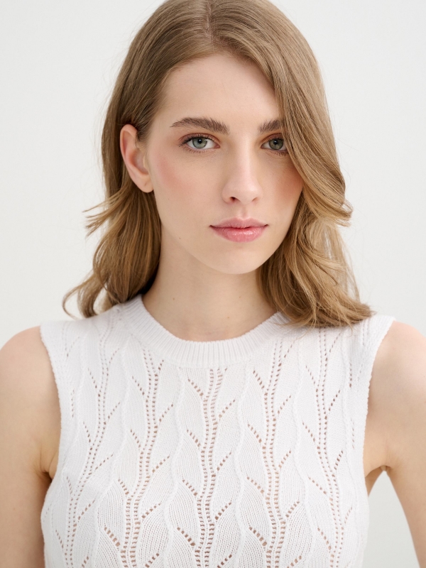 Sleeveless knit top with openwork white detail view