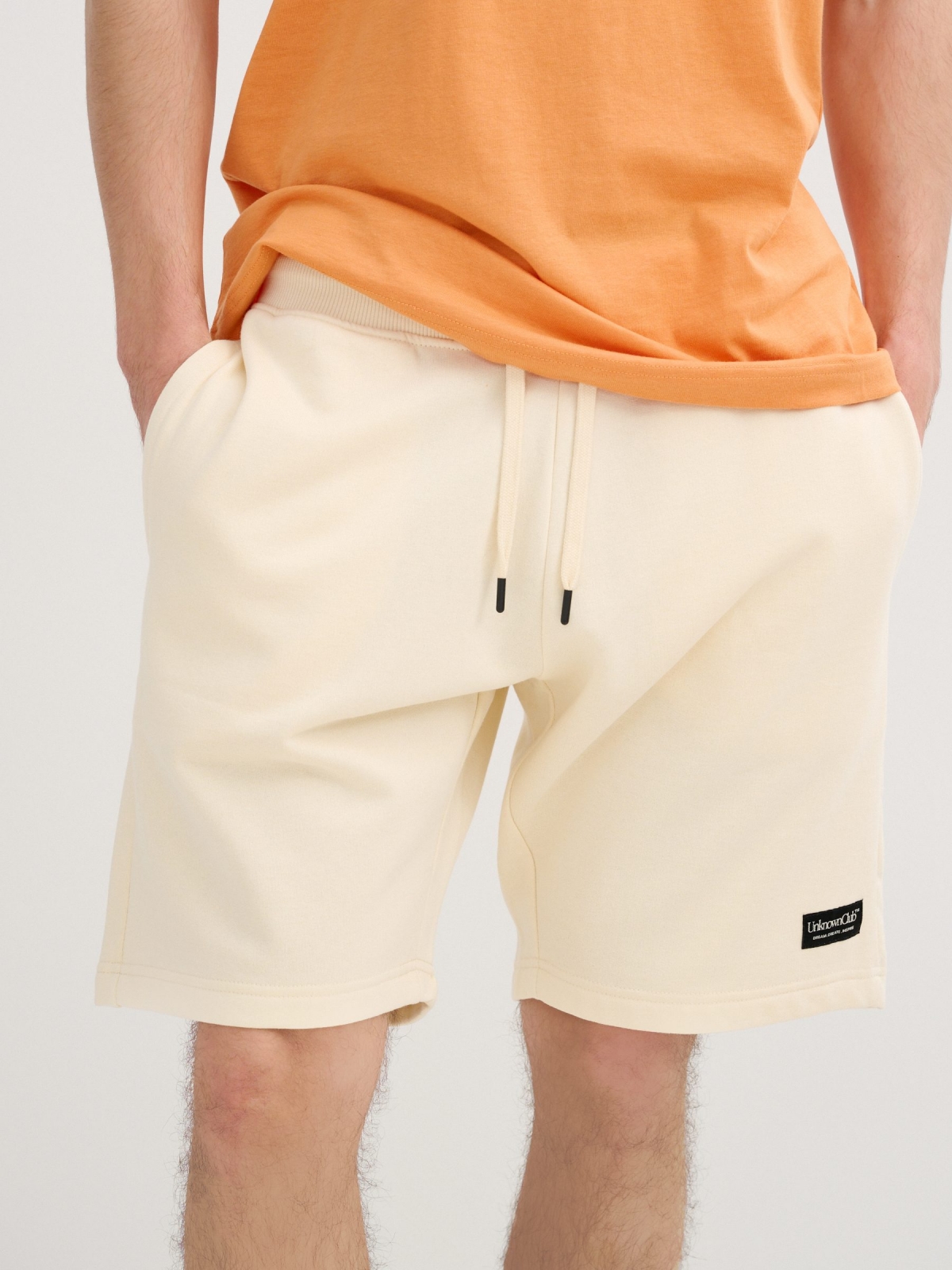 Bermuda jogger with laces off white middle back view