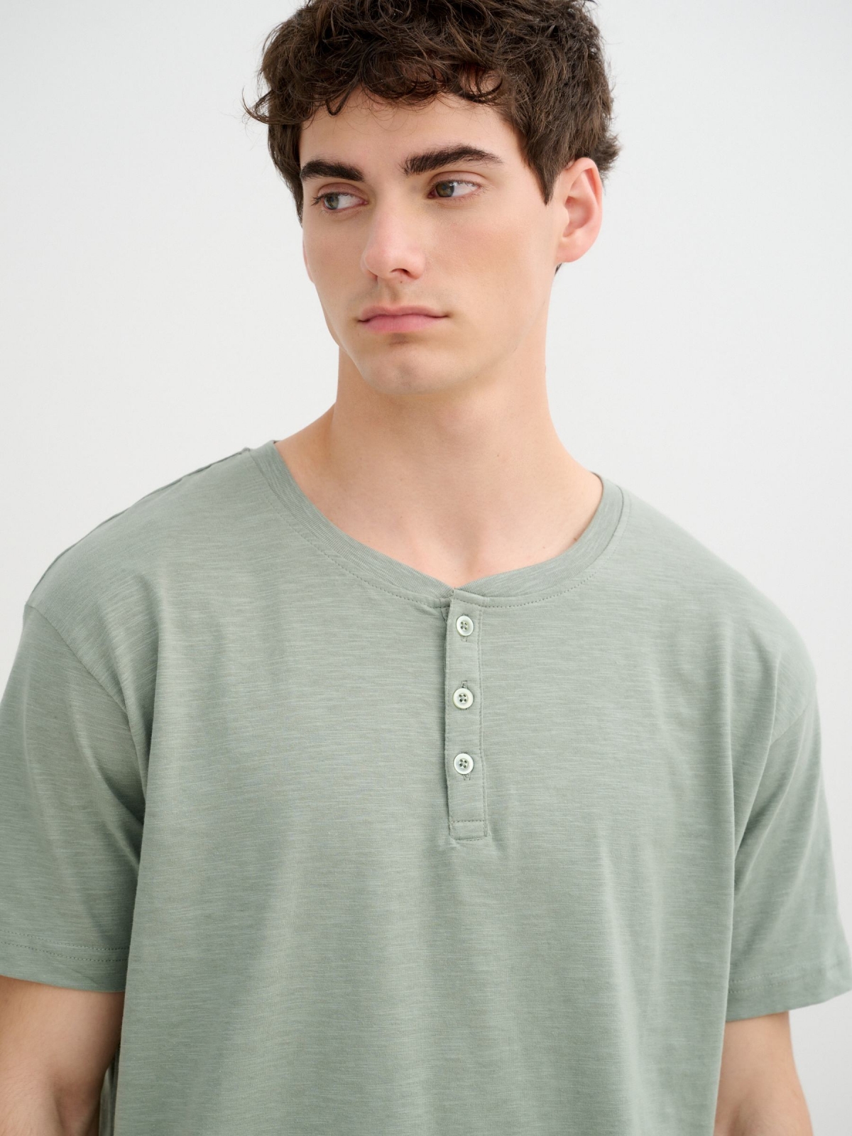 Flame t-shirt with henley collar green detail view