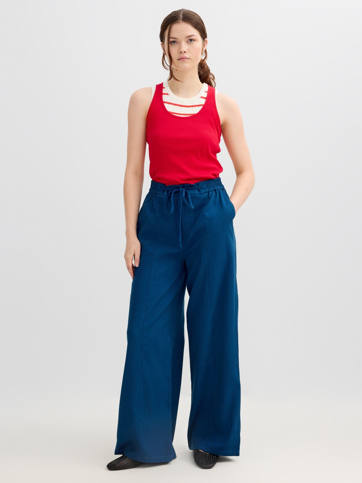 Fluid high-waisted palazzo pants blue front view