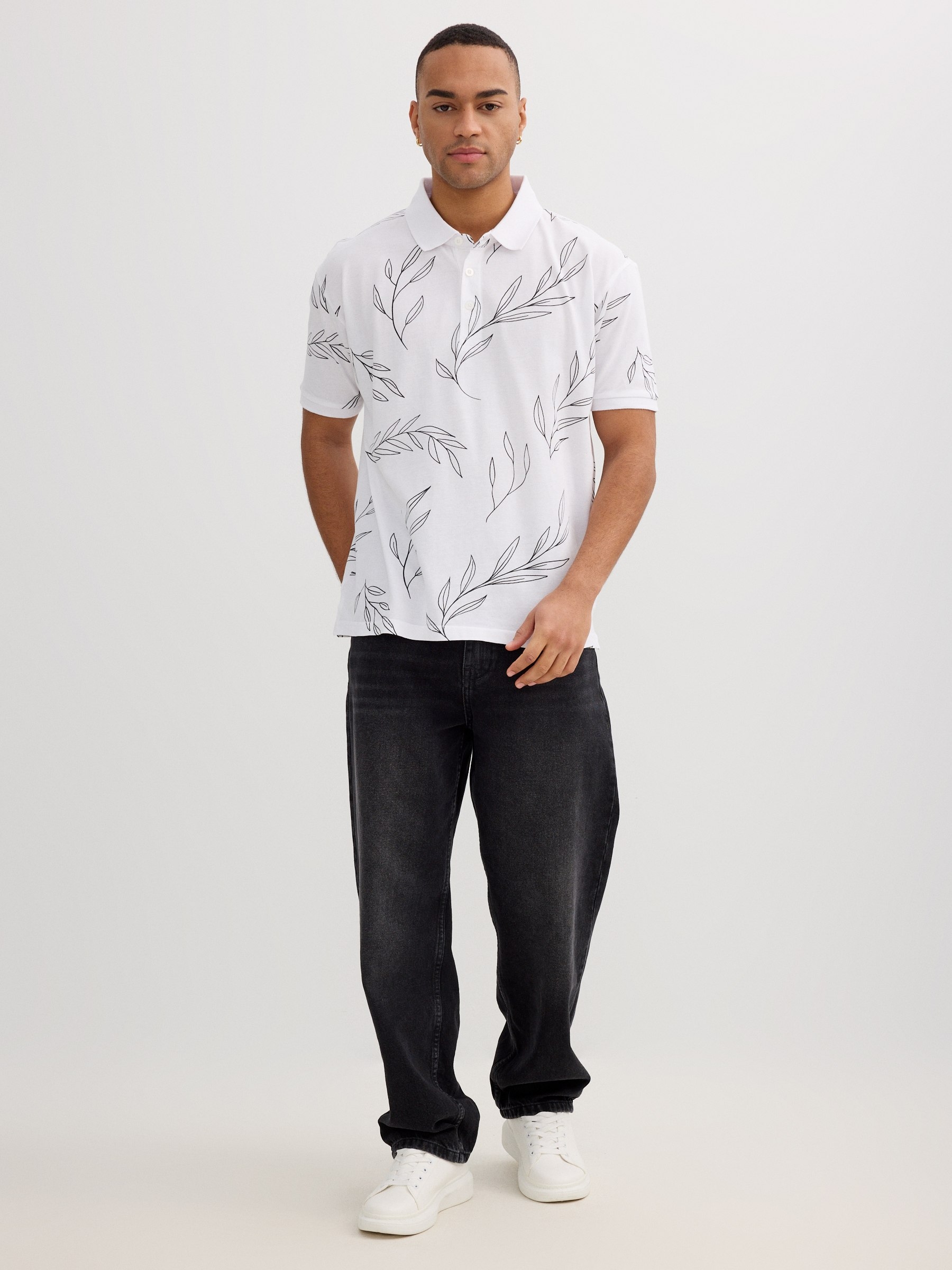 Polo piqué hojas tropicales