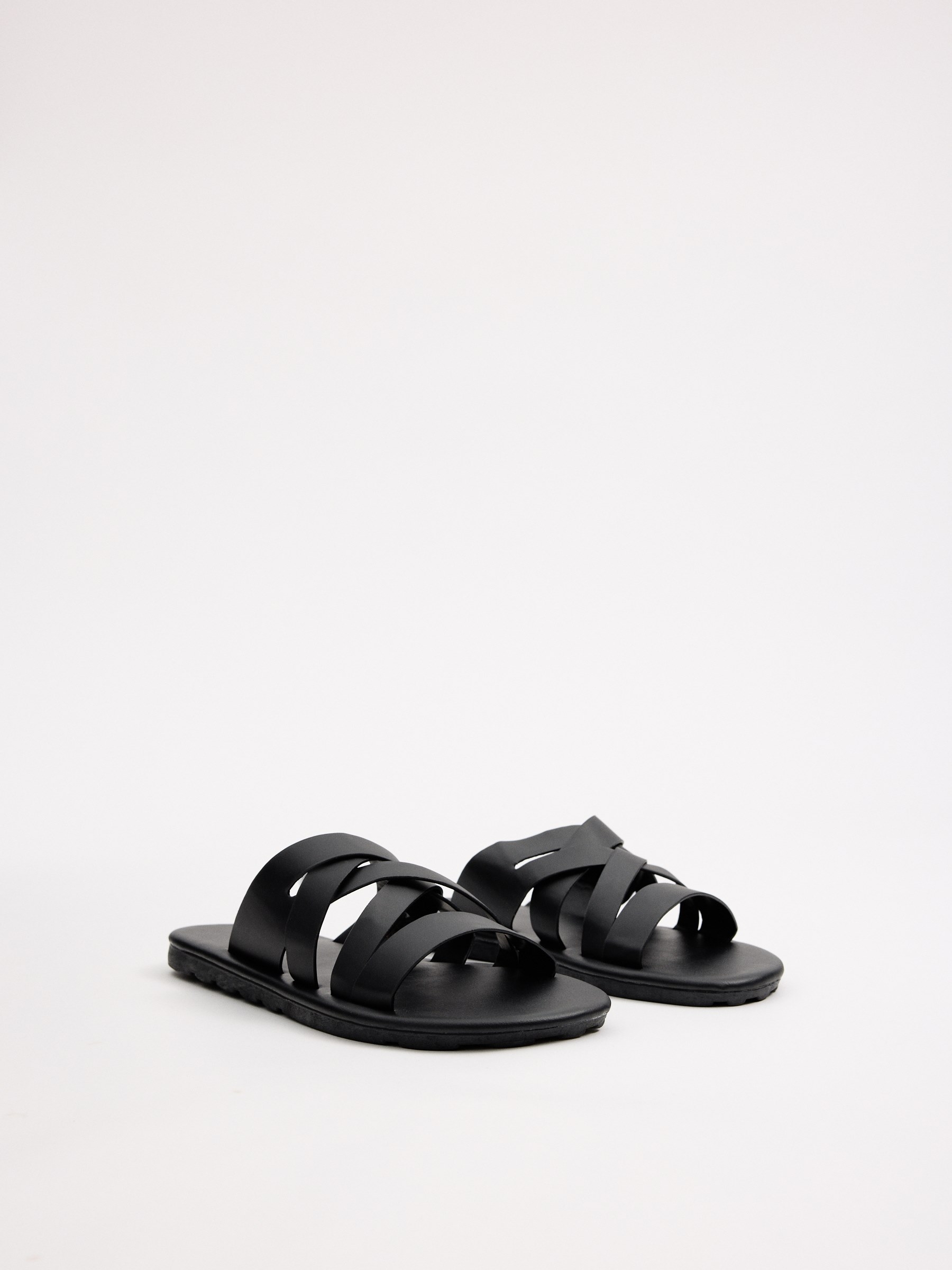 Cross-strap sandals black profile view