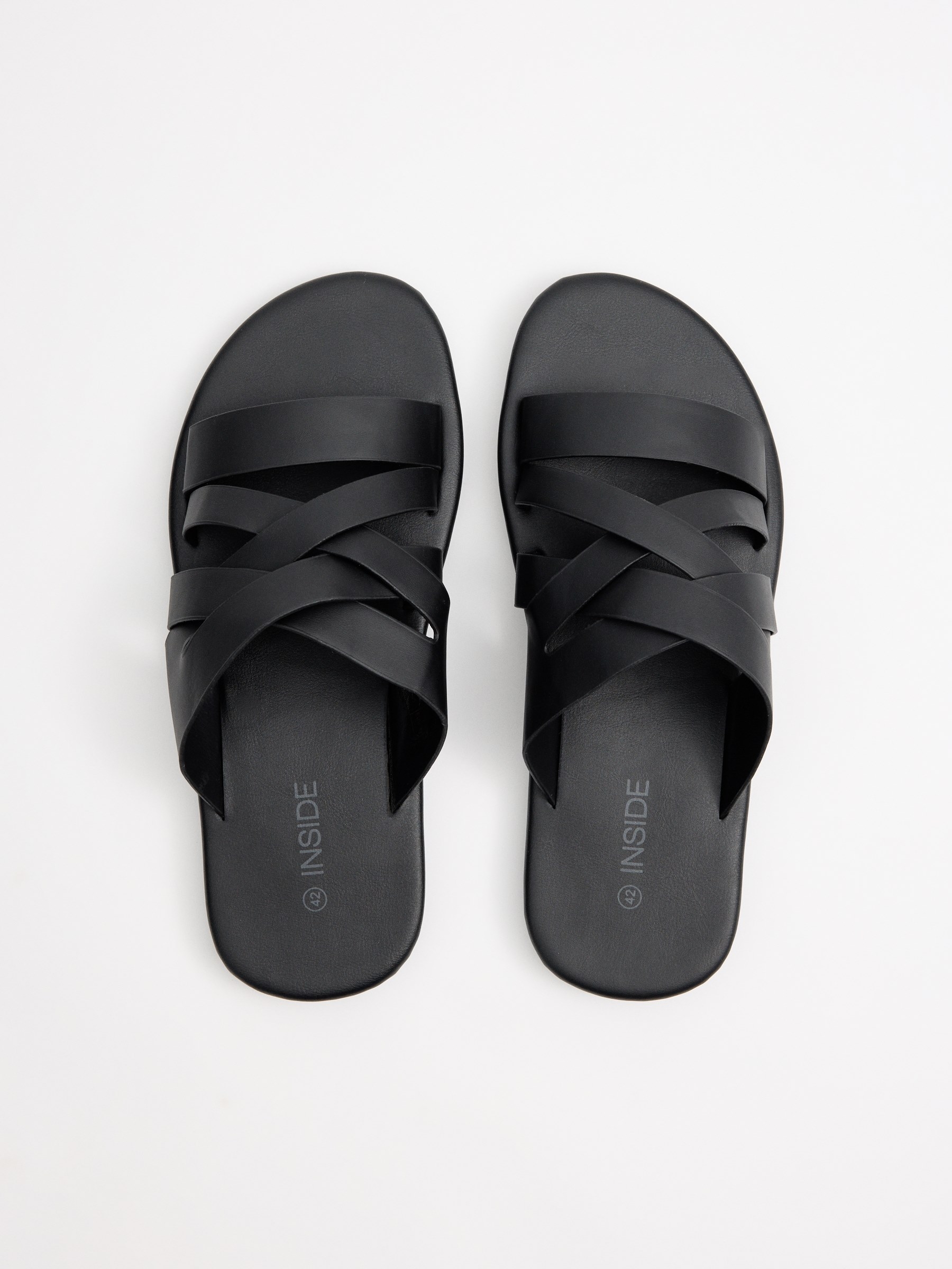 Cross-strap sandals black profile view