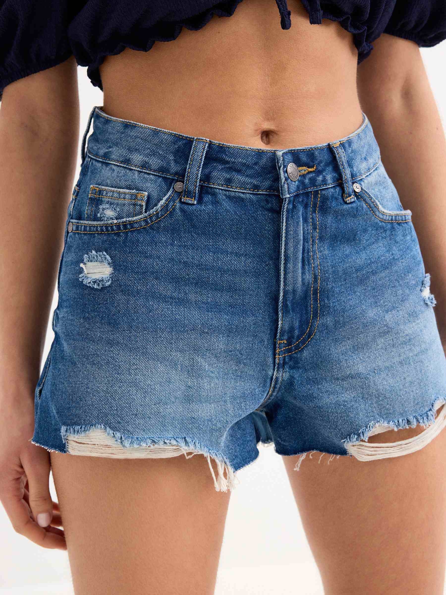 Ripped denim shorts blue middle front view