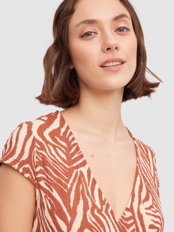 Tiger crossover neckline mini dress sand detail view