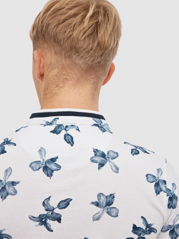 Tropical print polo white detail view