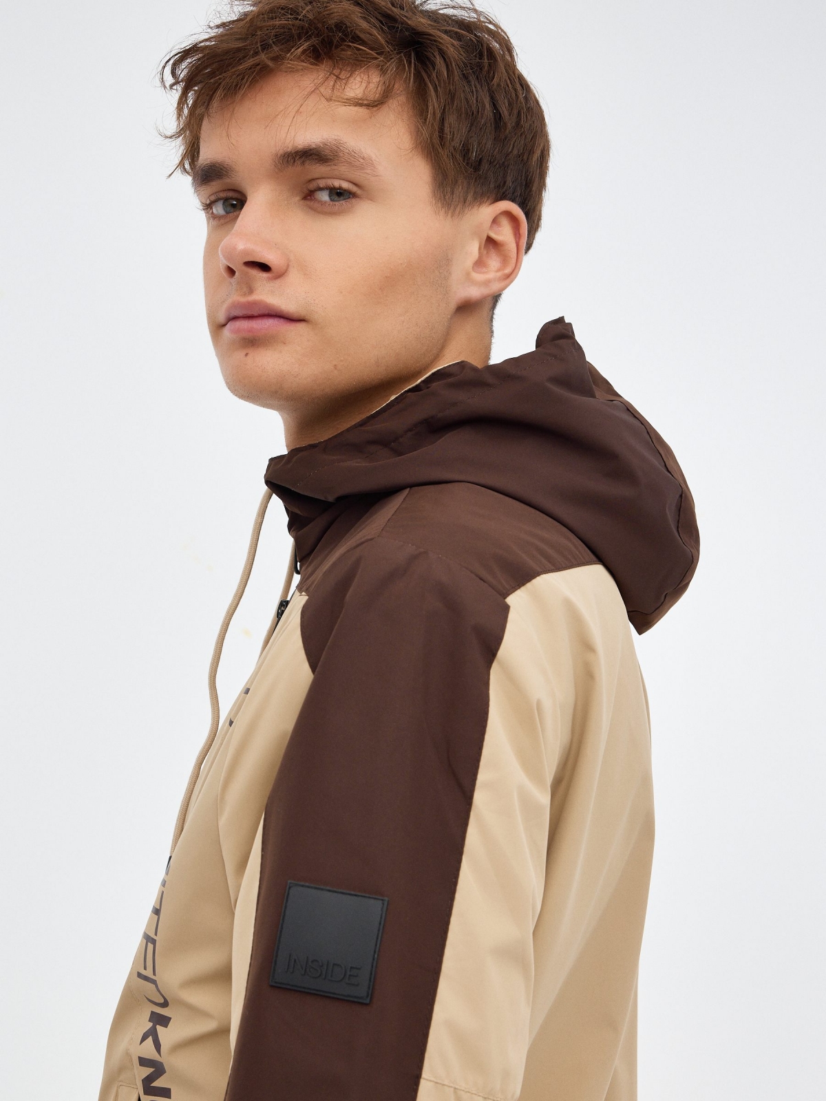 Jacket with hood sand detail view