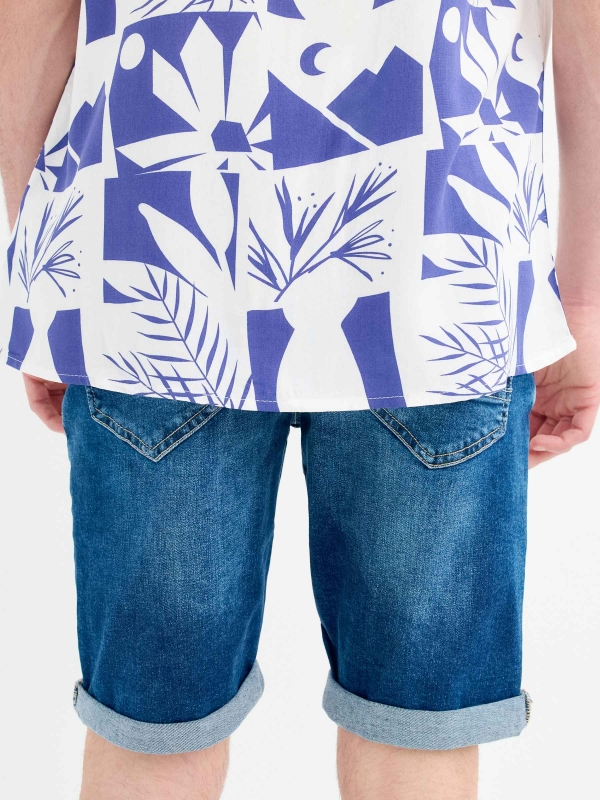 Denim Bermuda shorts with rips blue detail view