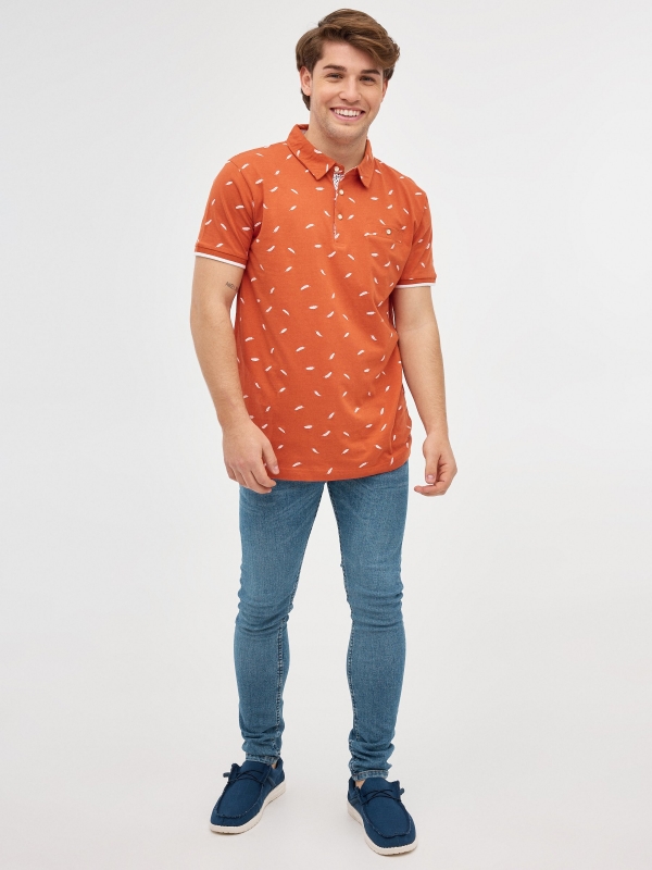 Feather print polo shirt brick red front view