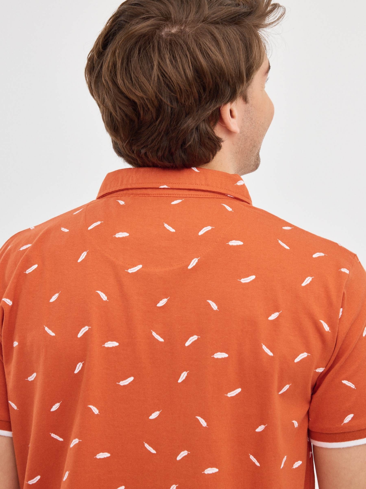 Feather print polo shirt brick red detail view