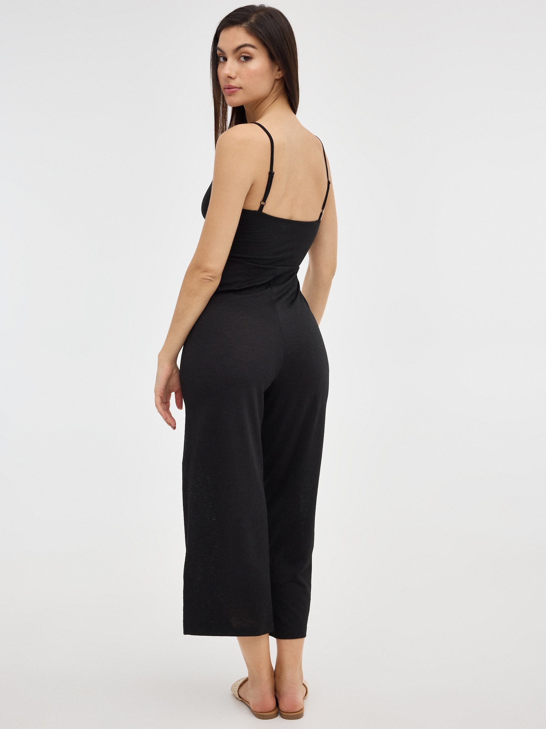 Black jumpsuit with crossover neckline black front view