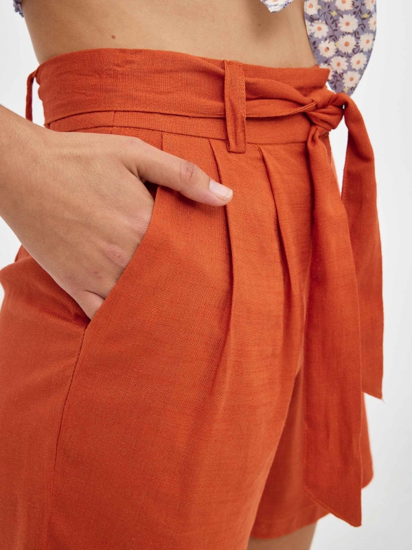 Short rústicos de pinzas teja vista detalle