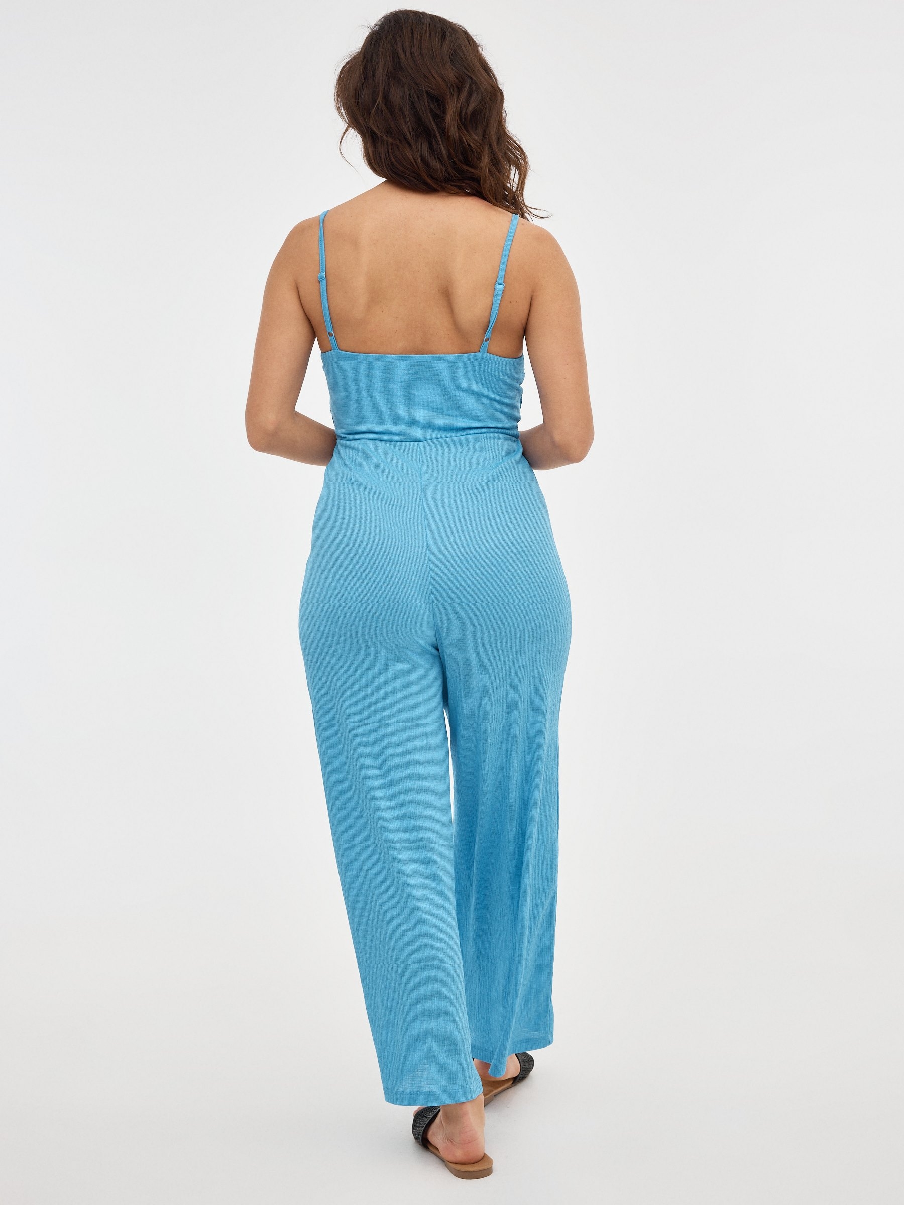Black jumpsuit with crossover neckline blue middle front view