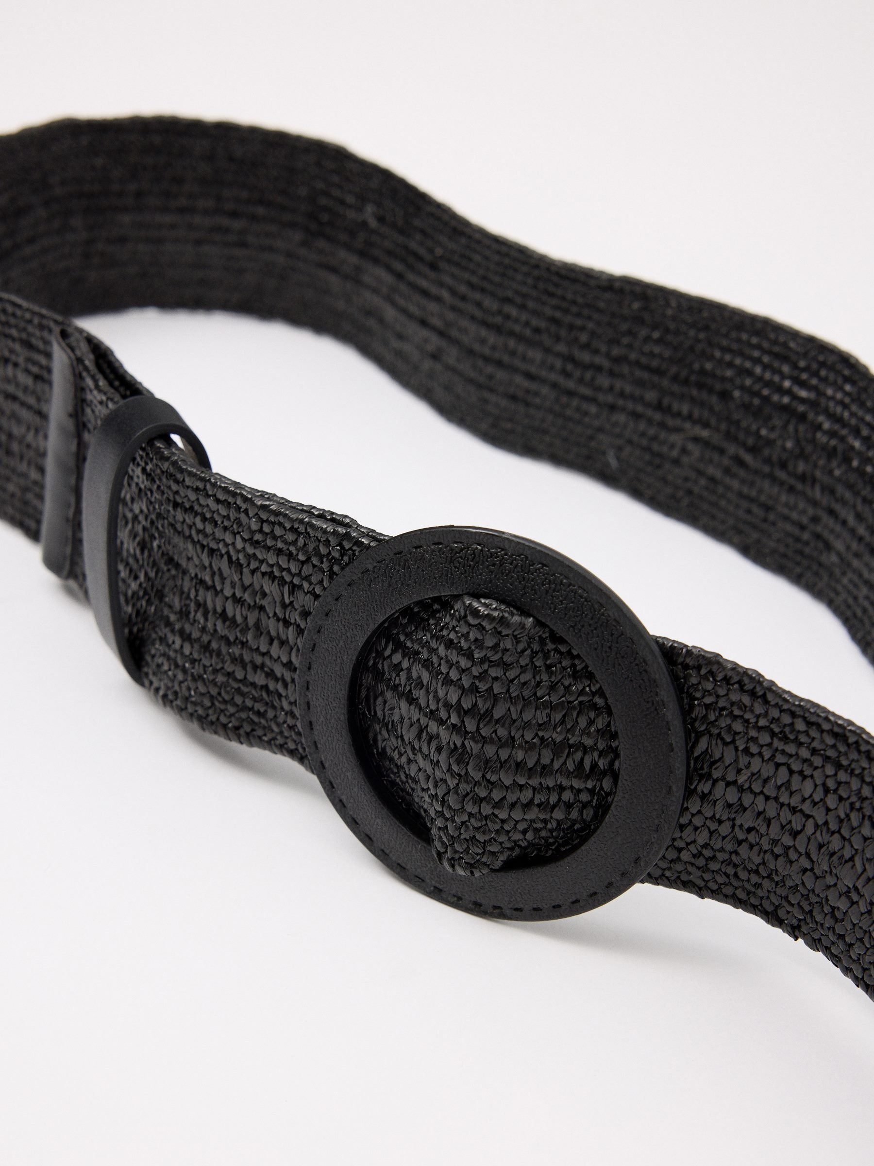 Round buckle elastic belt black rolled view