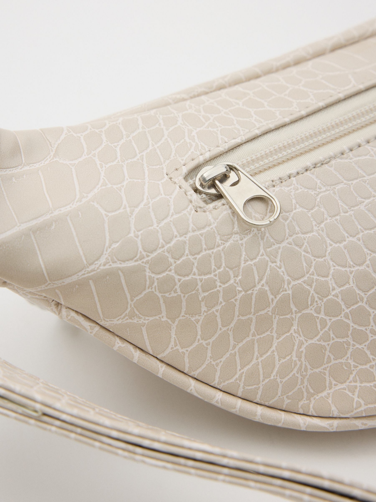 Leather effect fanny pack with chain 45º side view