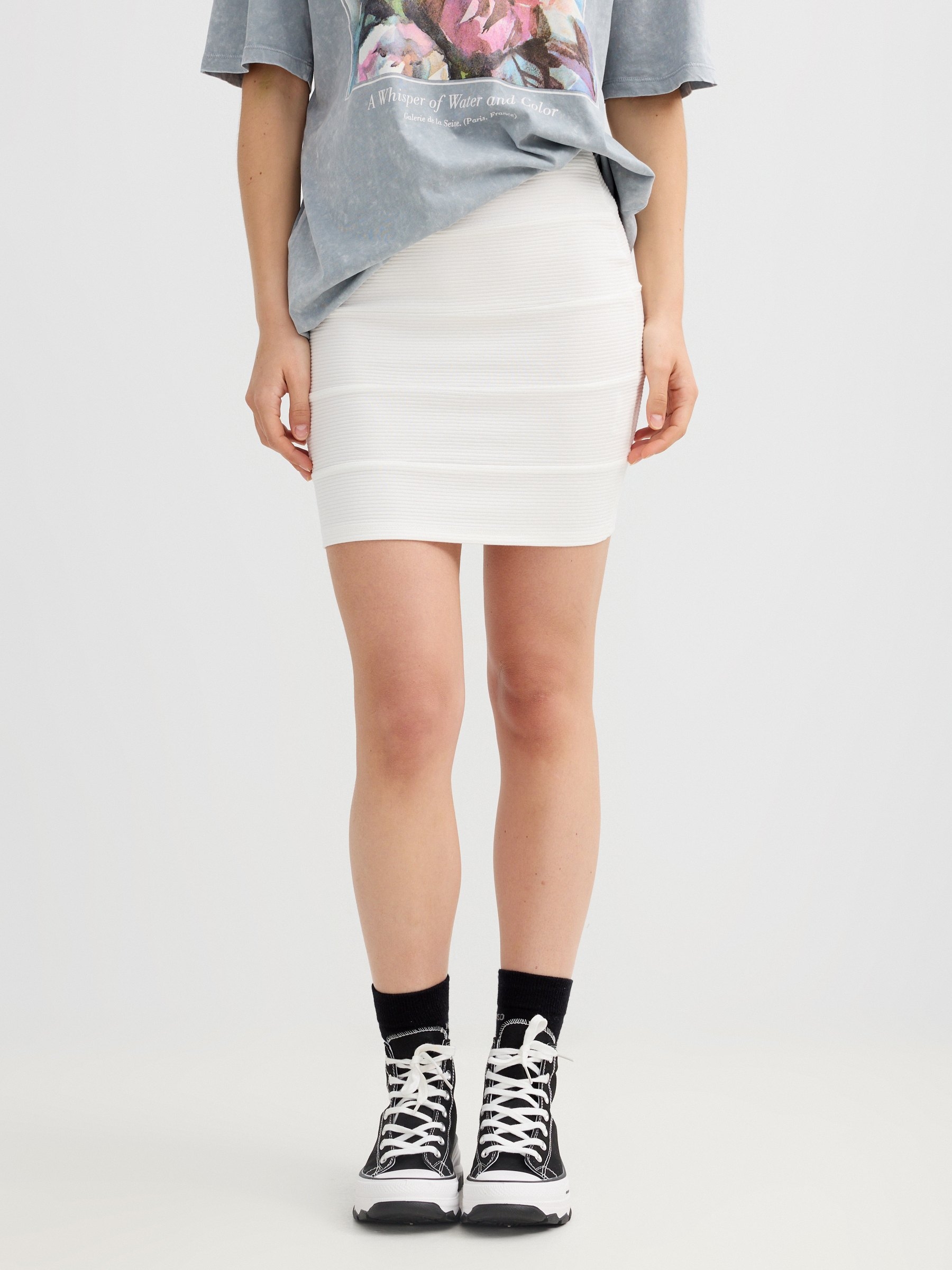 Black mini paneled skirt white middle front view