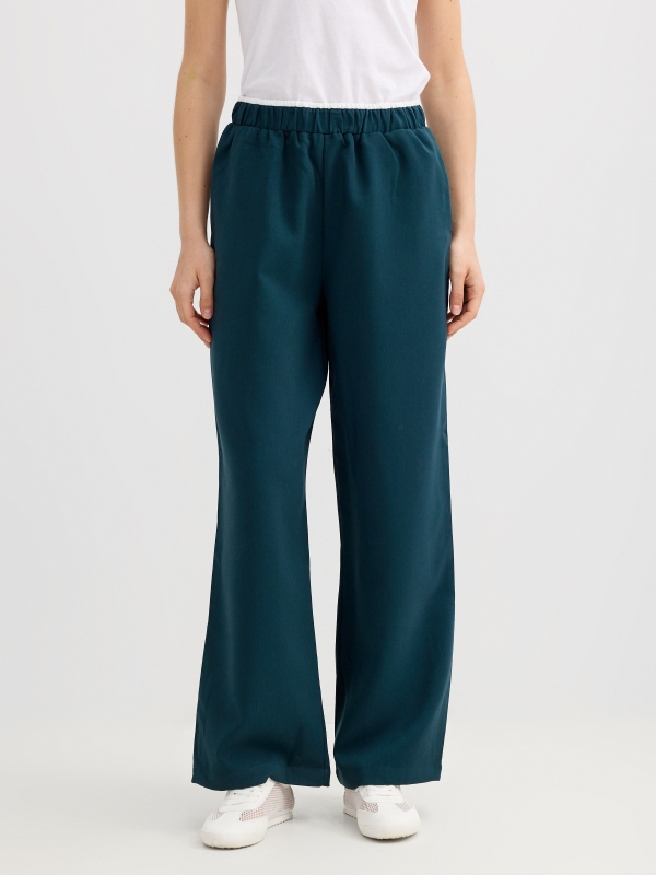 Calça fluida wide leg verde escuro vista meia frontal