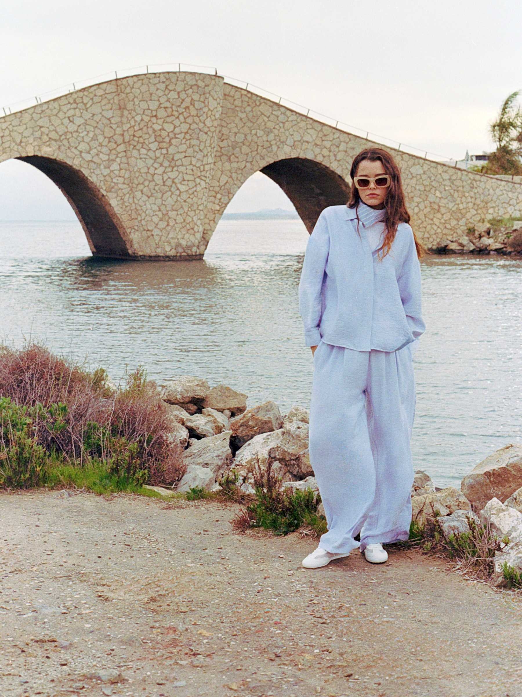 Fluid high-waisted palazzo pants light blue front view