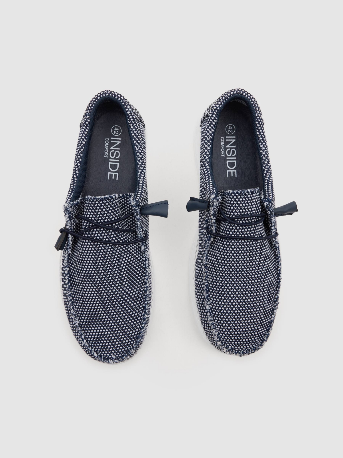 Deportiva lona elástica azul vista cenital