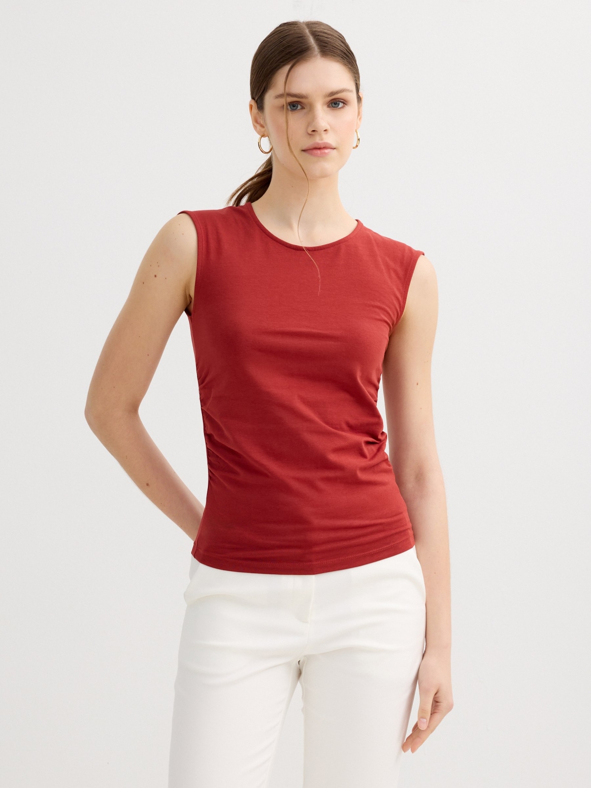 Sleeveless ruched slim-fit top brick red middle front view