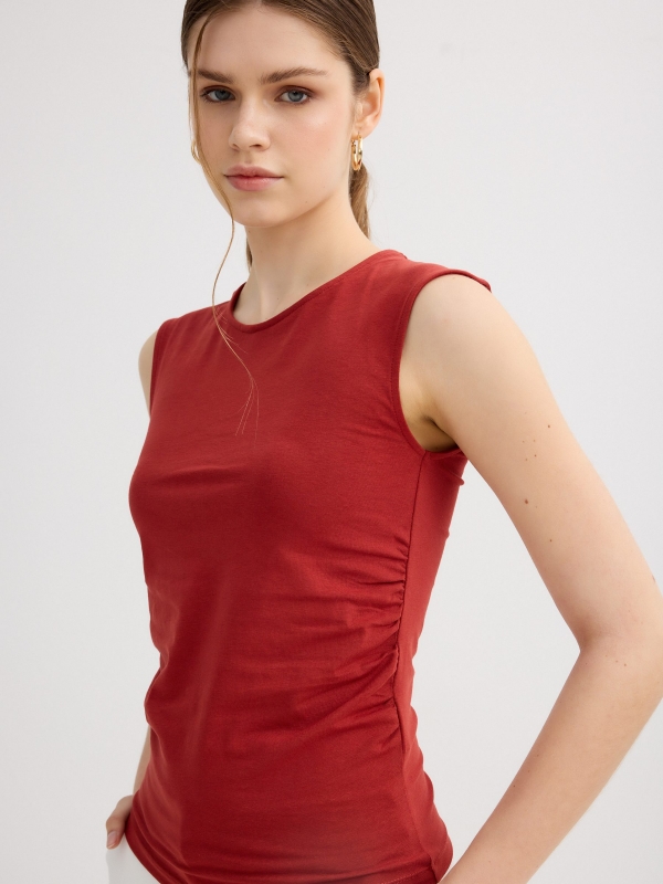 Sleeveless ruched slim-fit top brick red detail view