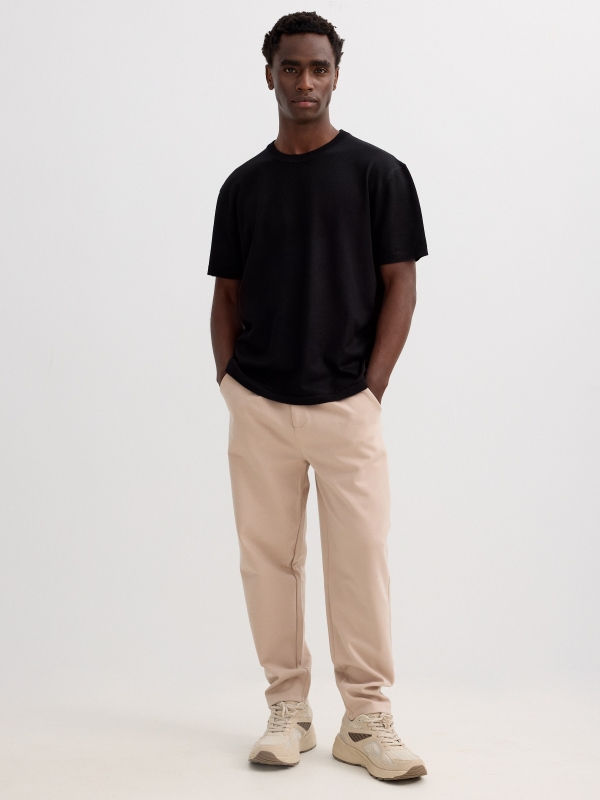 Fleece joggers with drawstrings beige front view