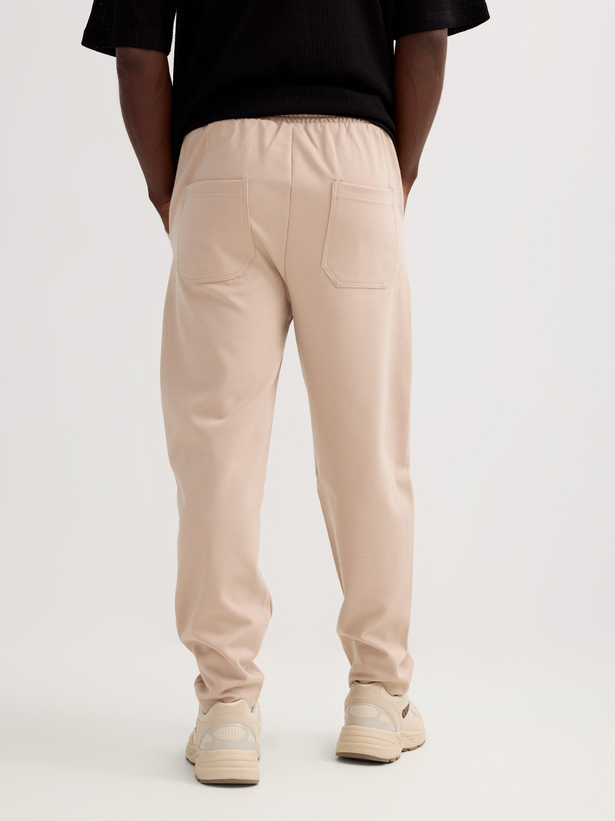 Fleece joggers with drawstrings beige middle back view