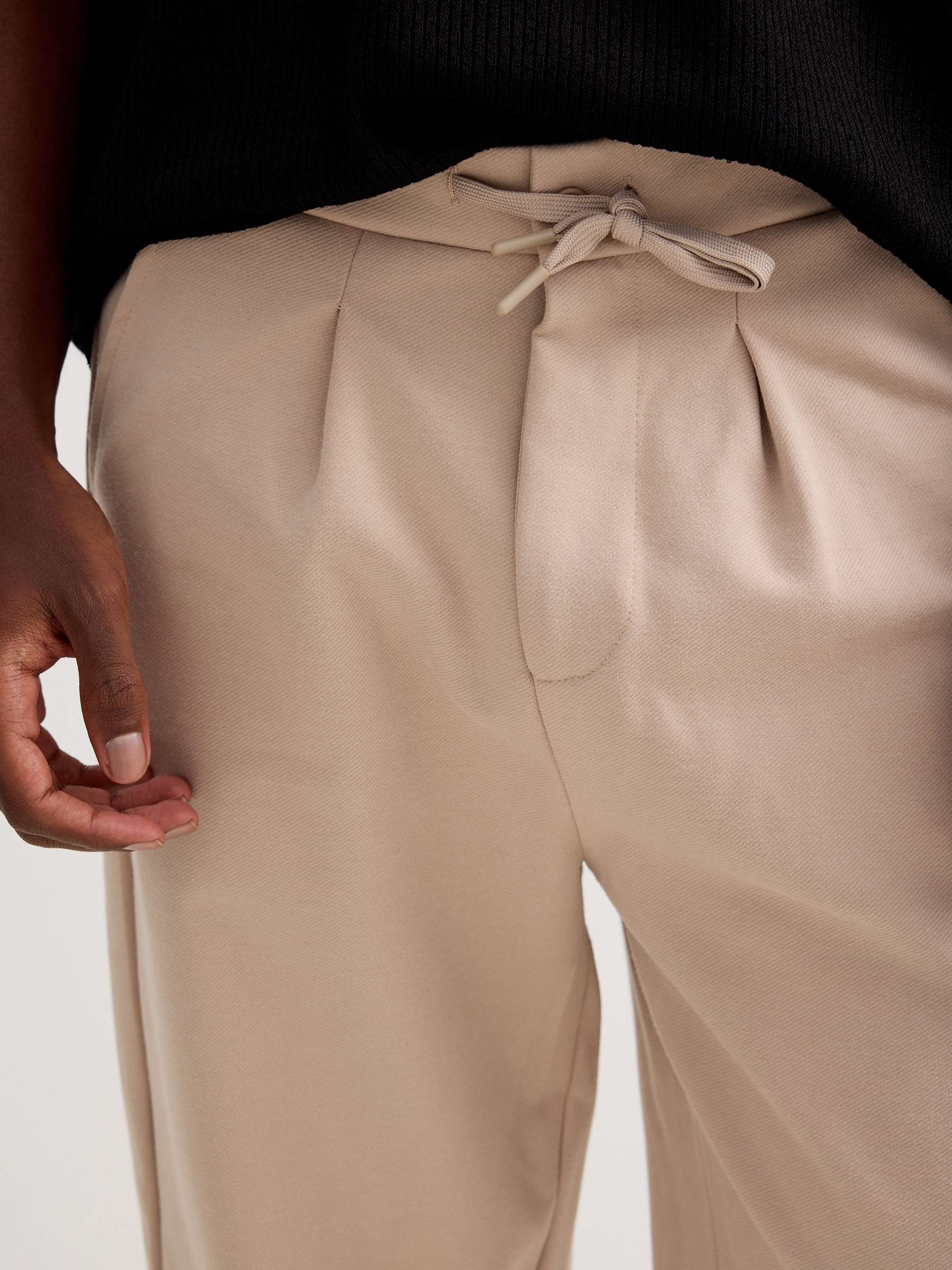 Jogger de felpa con cordones beige vista general frontal