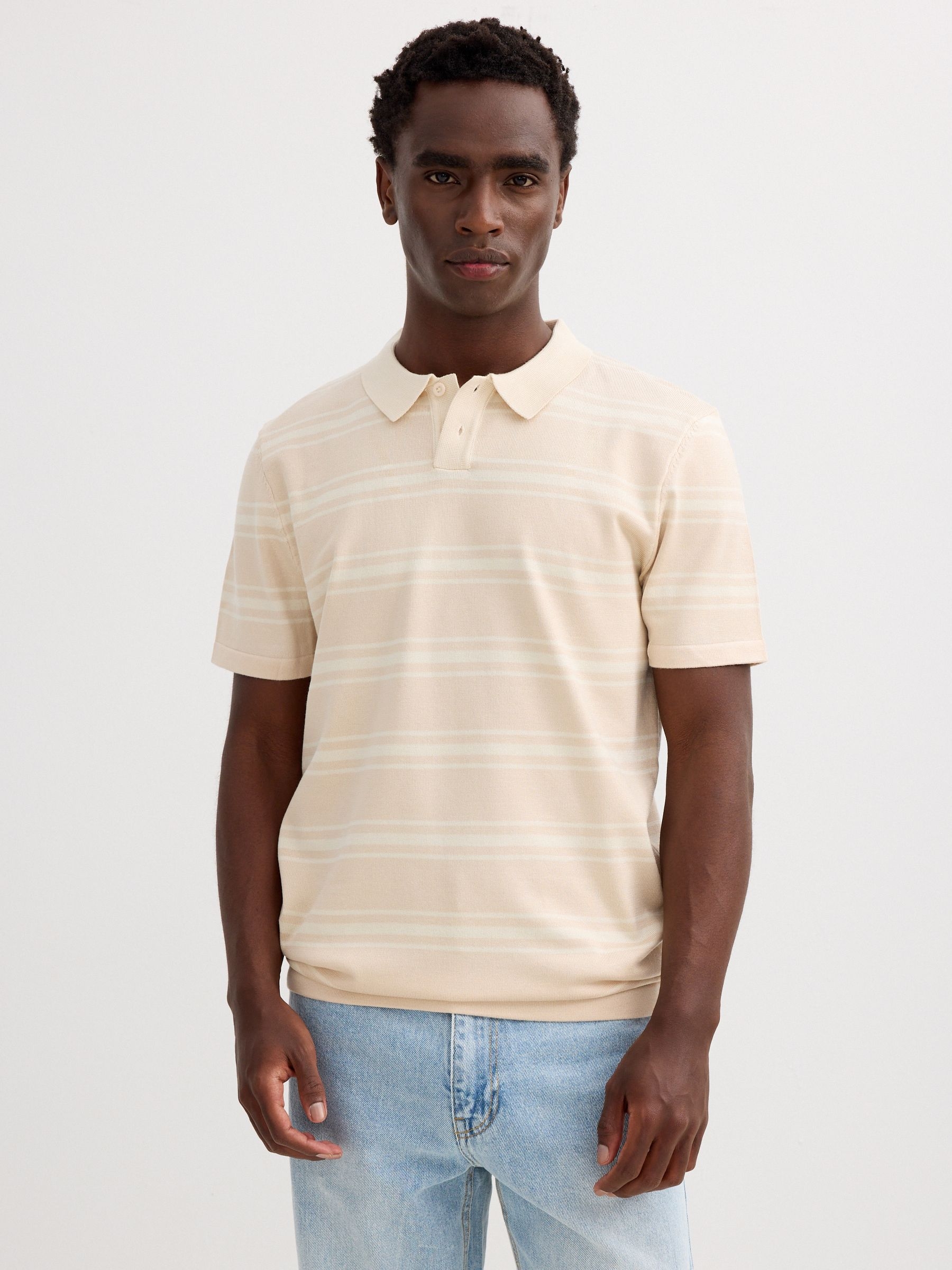 Striped knit polo shirt with buttons raw middle front view
