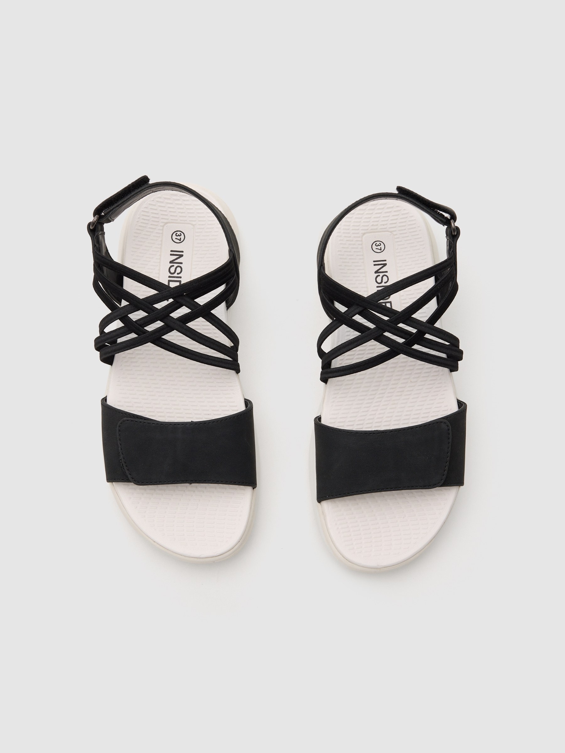Flat sandal with crossed faux leather straps black