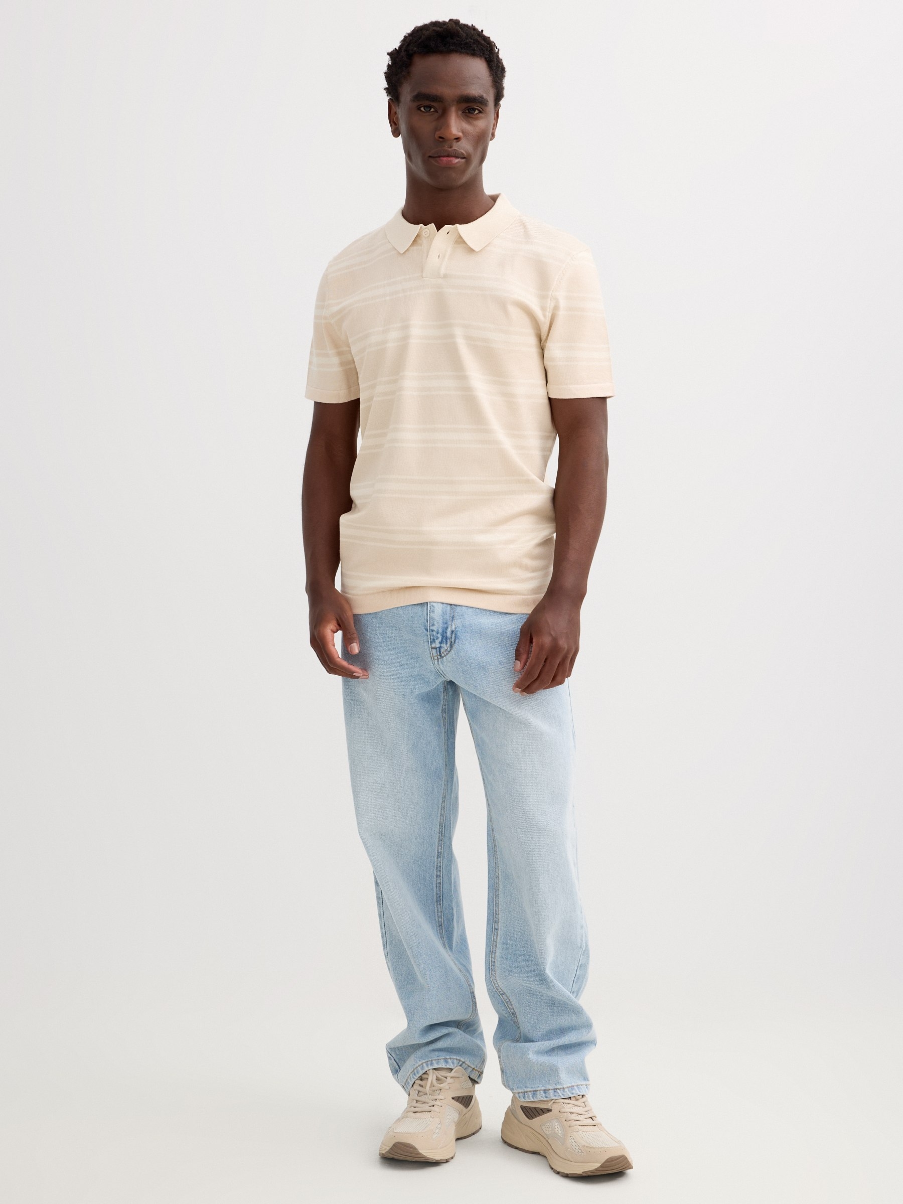 Striped knit polo shirt with buttons raw middle front view