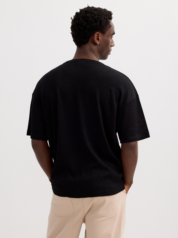 Camiseta punto lisa negro vista media trasera