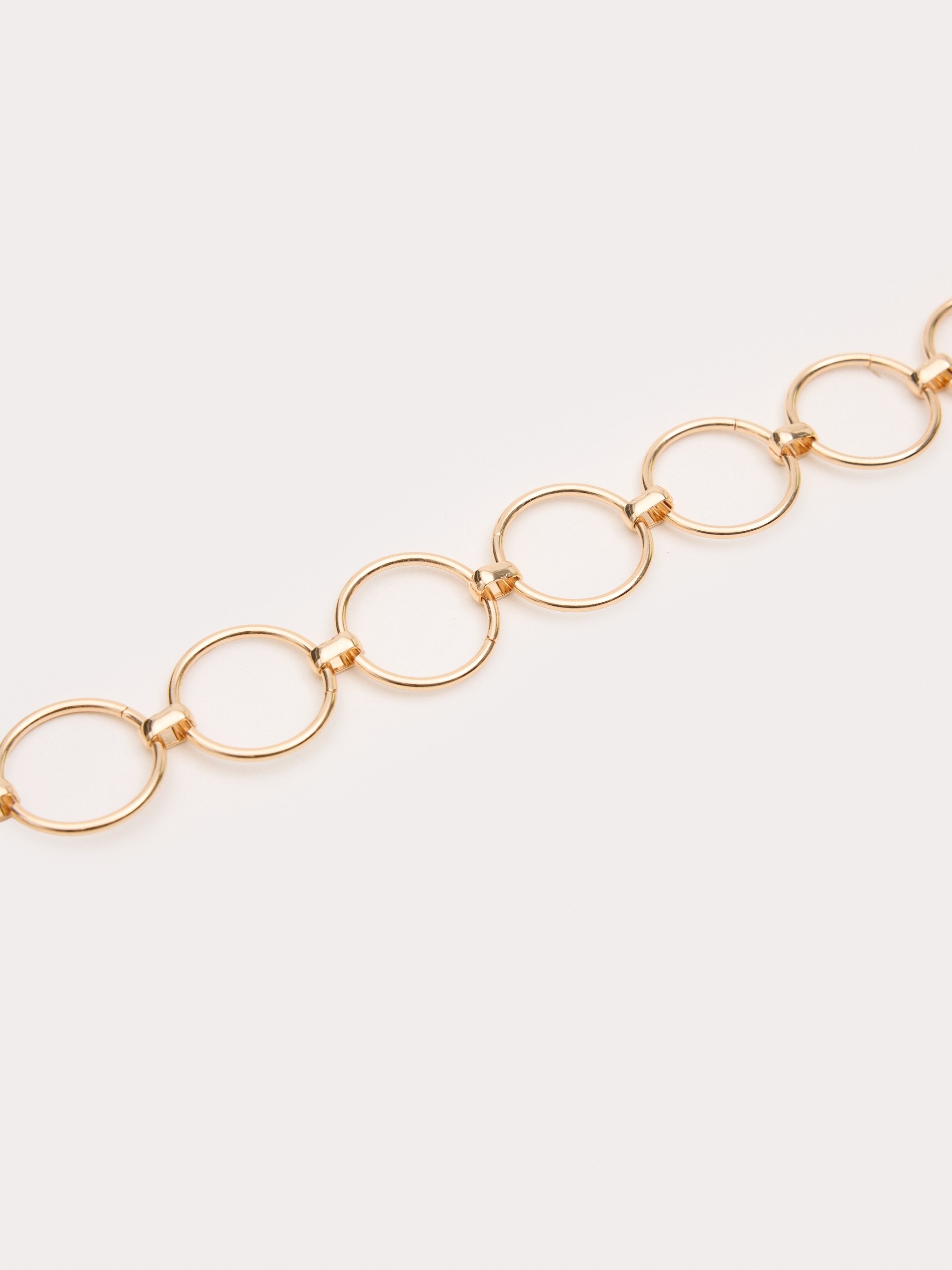 Cinturón cadena dorada con hebilla redonda dorado