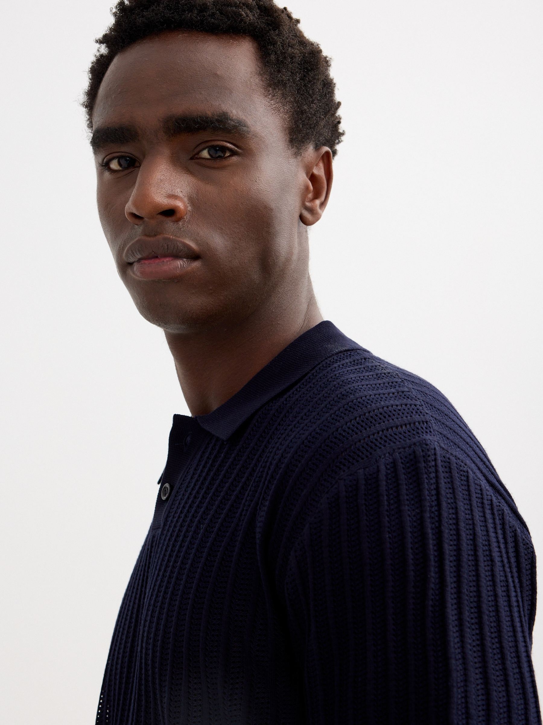 Plain knit polo shirt with buttons green middle front view