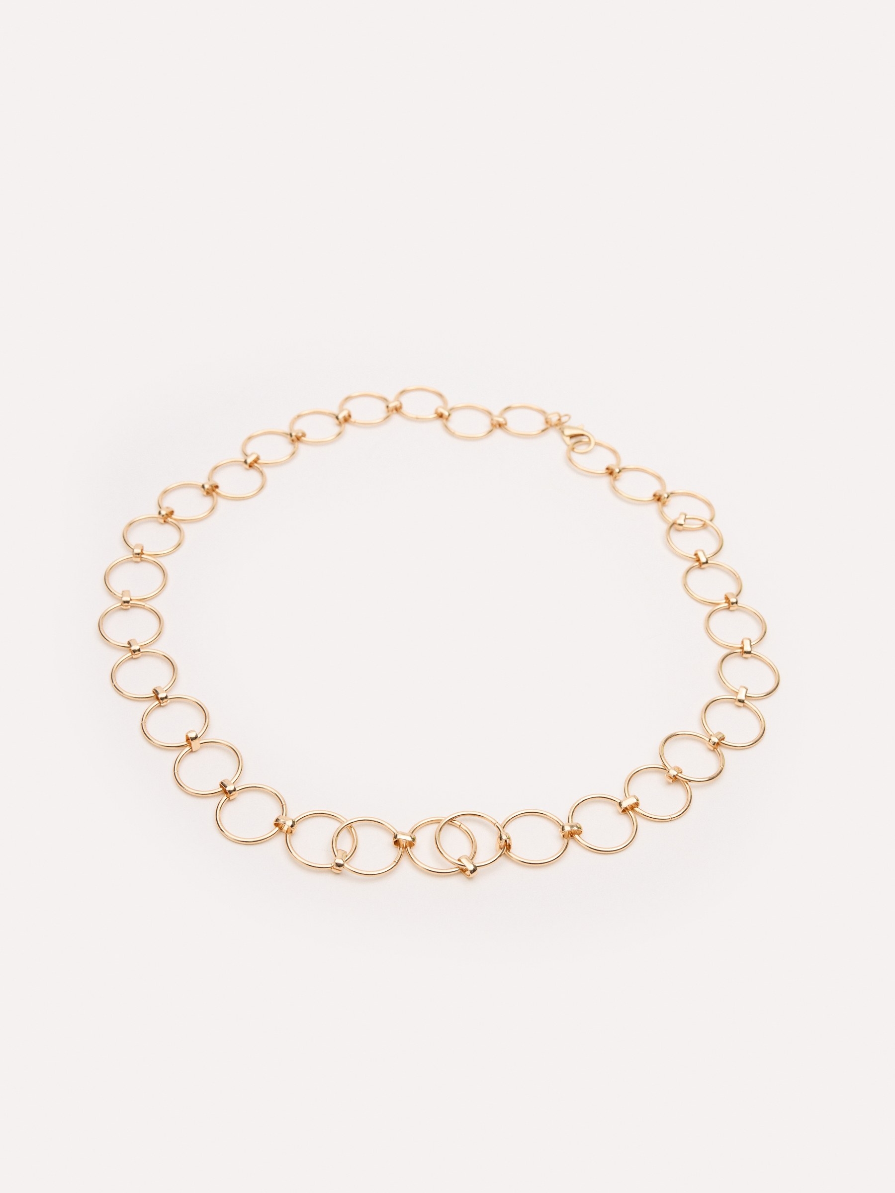 Cinturón cadena dorada con hebilla redonda dorado