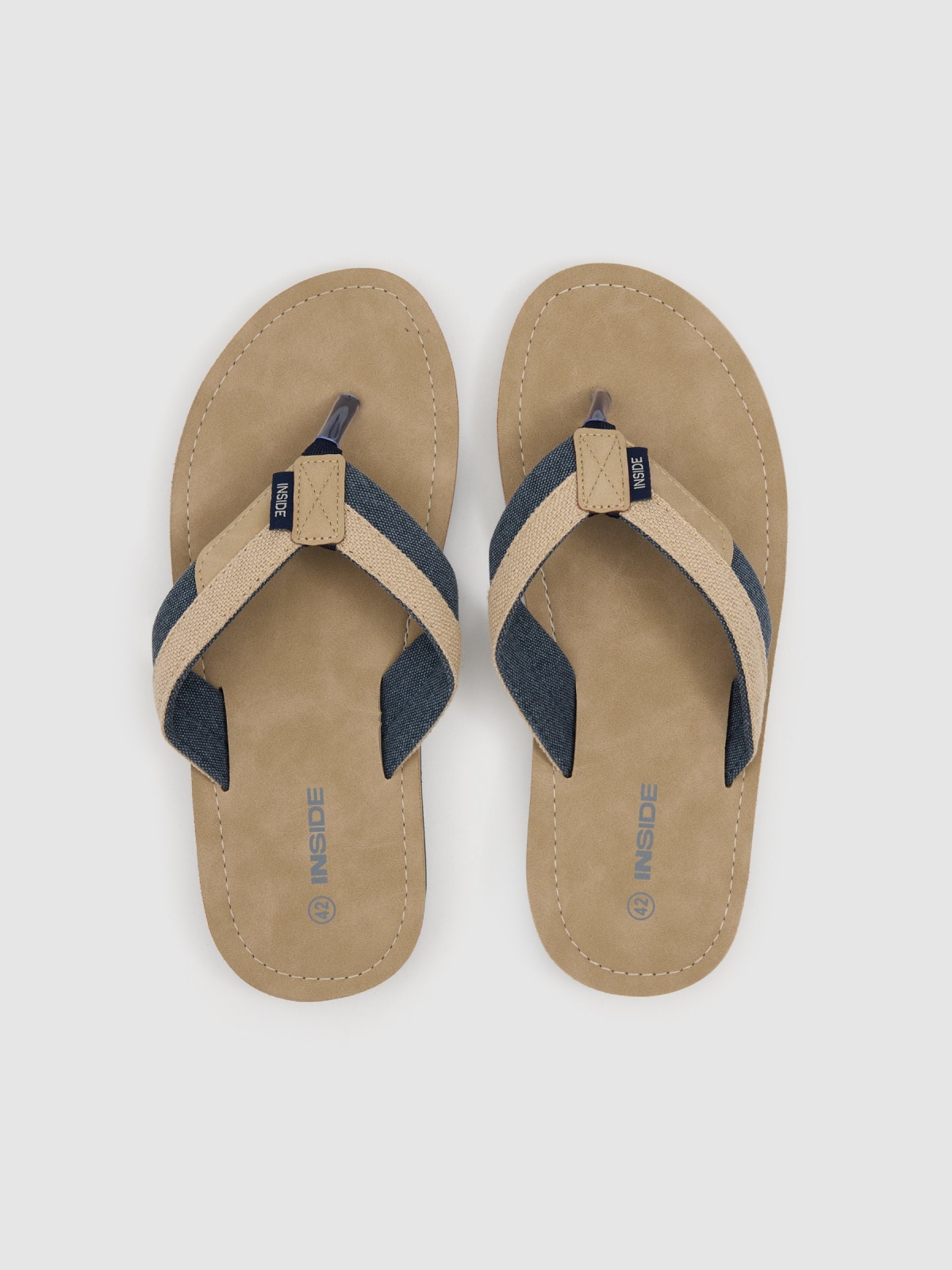 Canvas sandals sand zenithal view