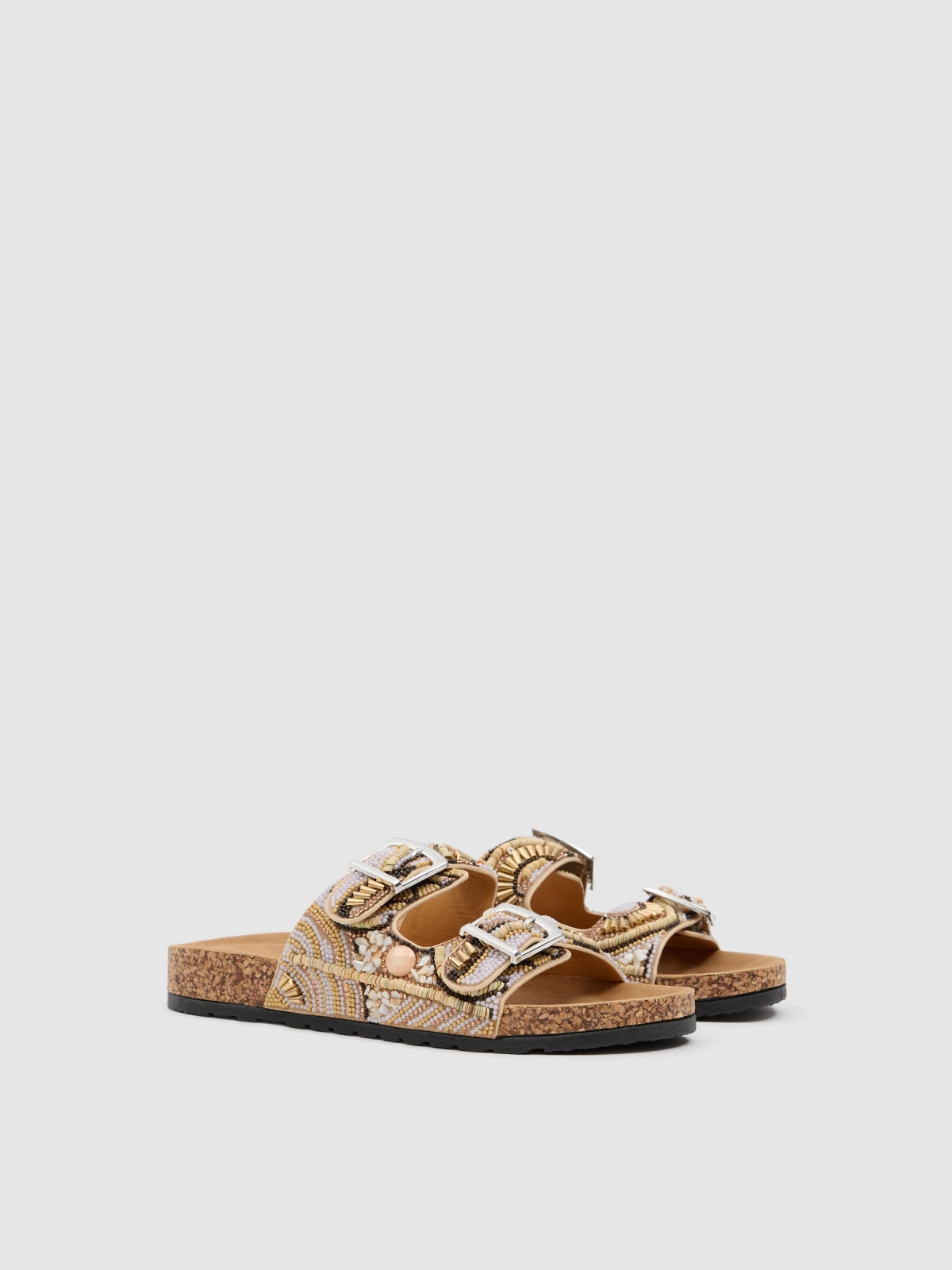 Sandalia doble hebilla brillos beige vista frontal 45º