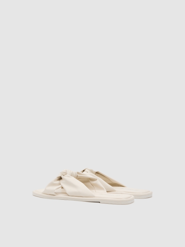 heeled sandal with bow strap beige 45º back view