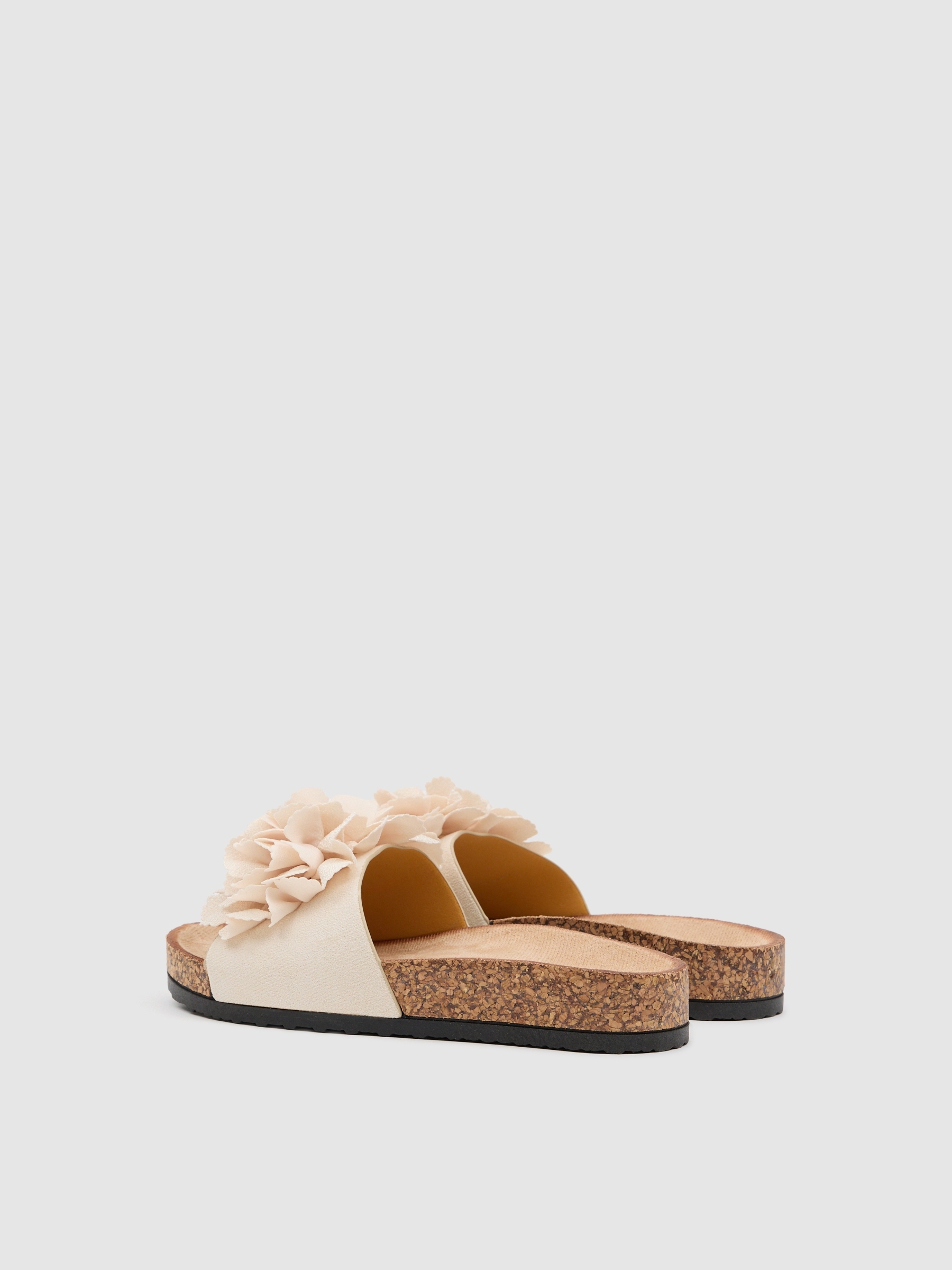 Pom-pom sandals with leather effect raw