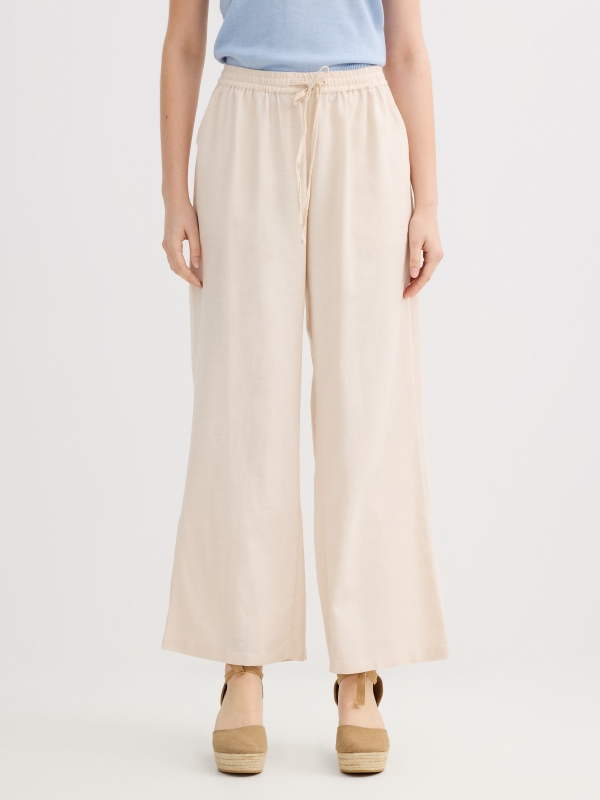 Pantalón lino fluido tiro alto beige vista media frontal