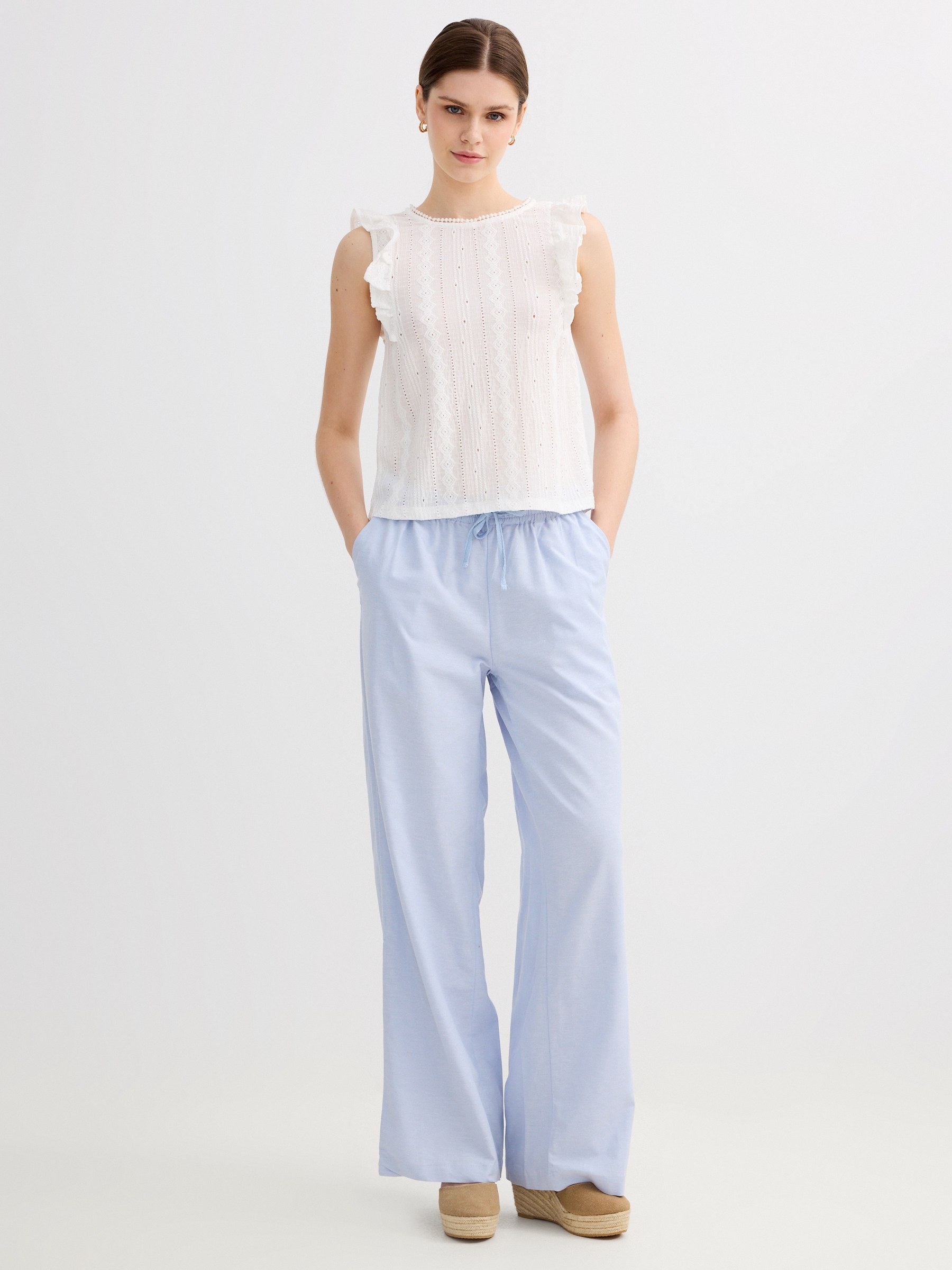 Fluid high-waisted linen pants light blue front view