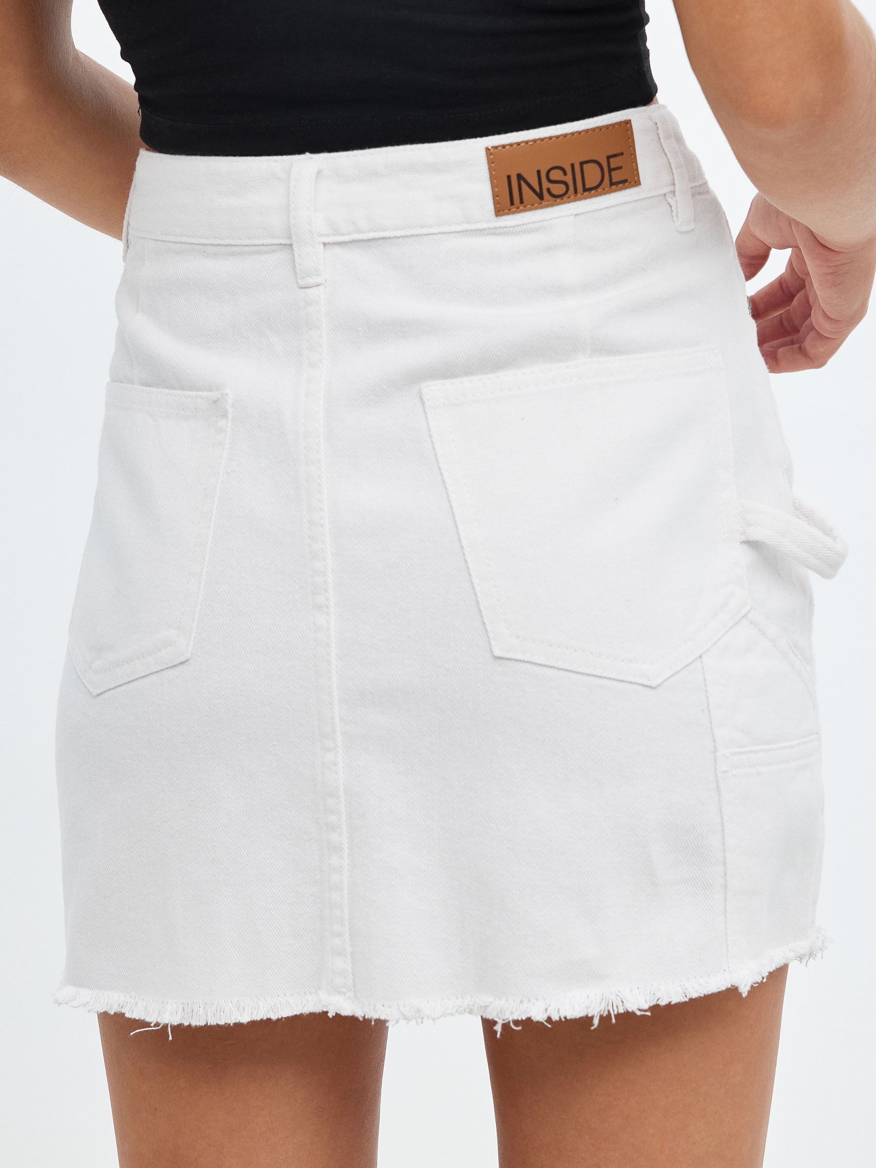Denim skirt with pleated hem white middle front view