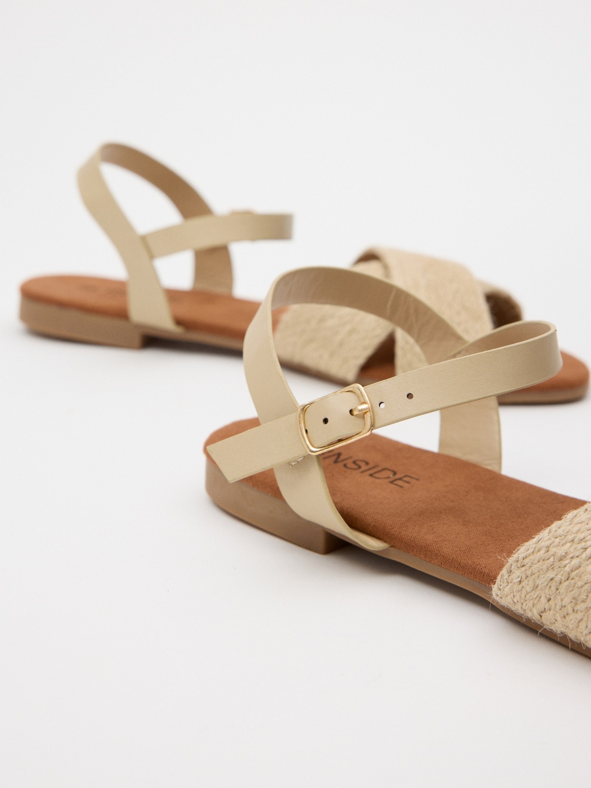 Natural jute crossed sandal sand detail view