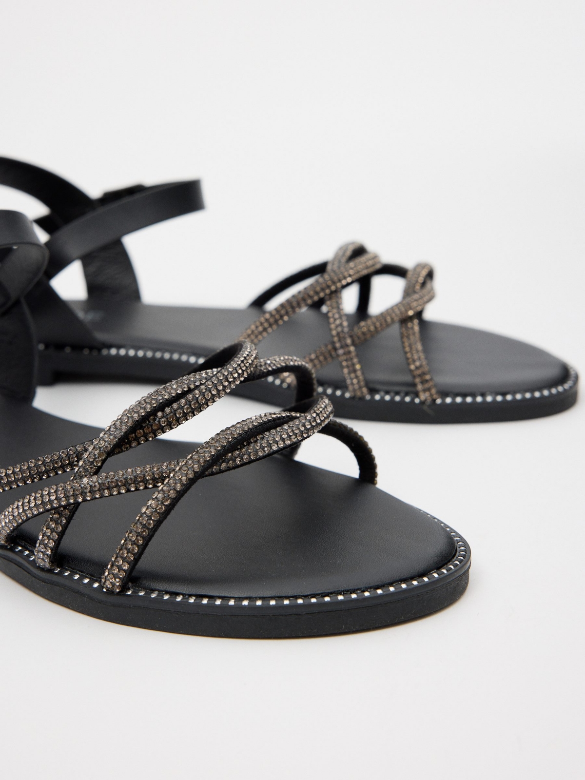 Sandal with shiny patent leather straps black detail view
