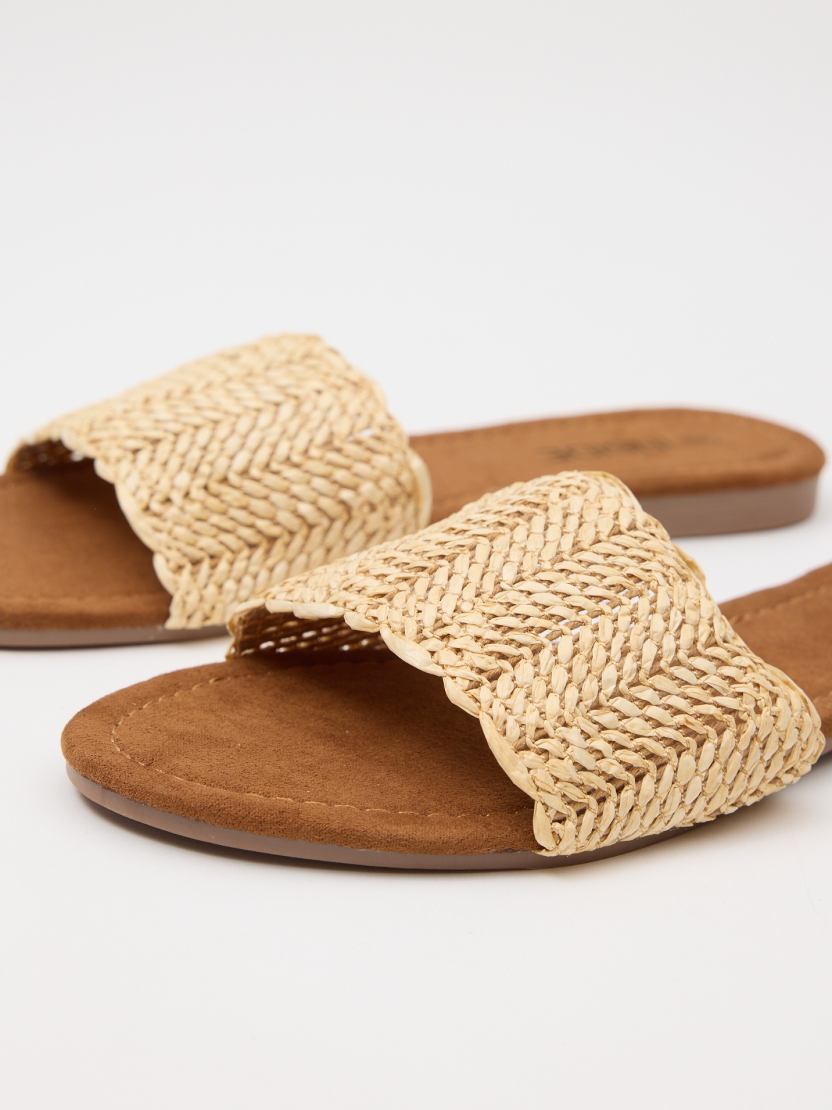 Intertwined raffia bangle sand detail view