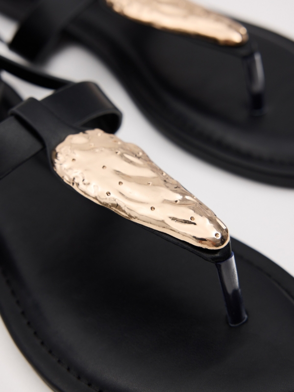 Flat sandal with buckle straps black detail view