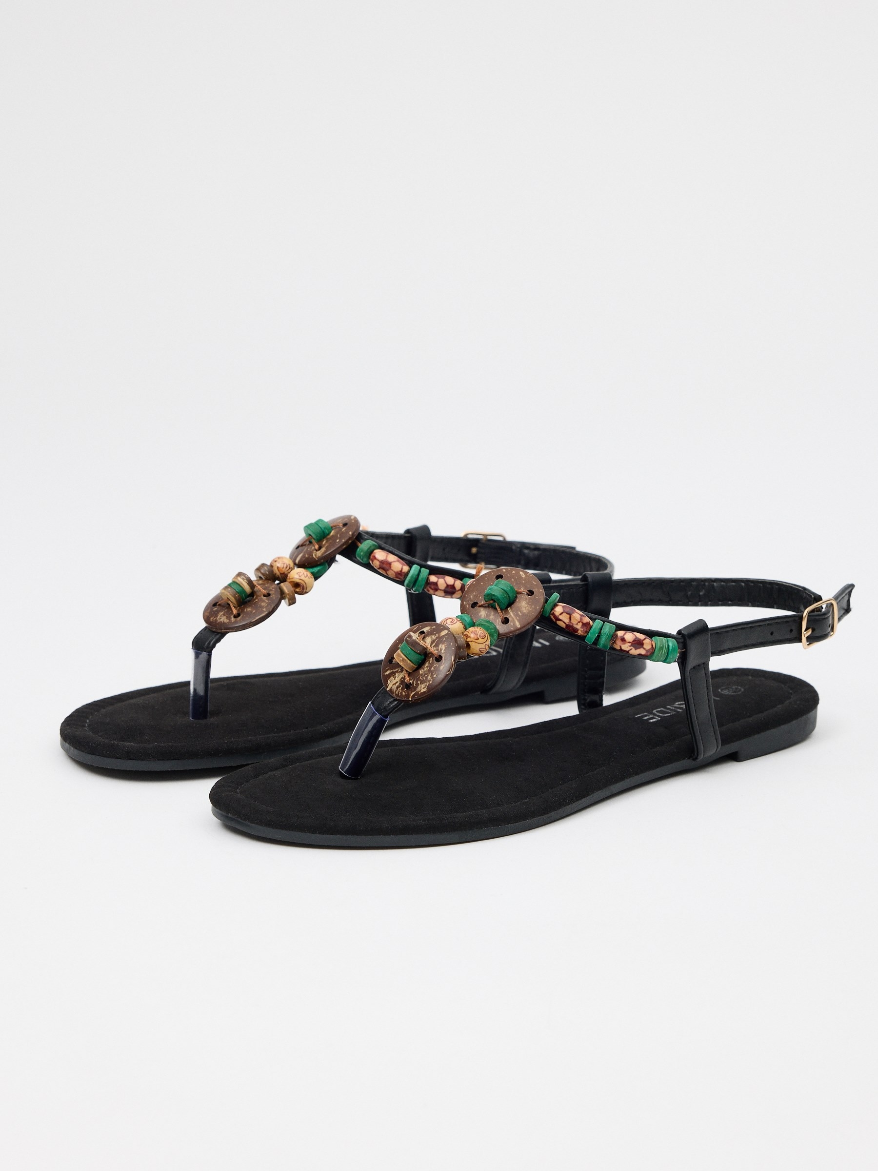Sandal toe strap with avalorius