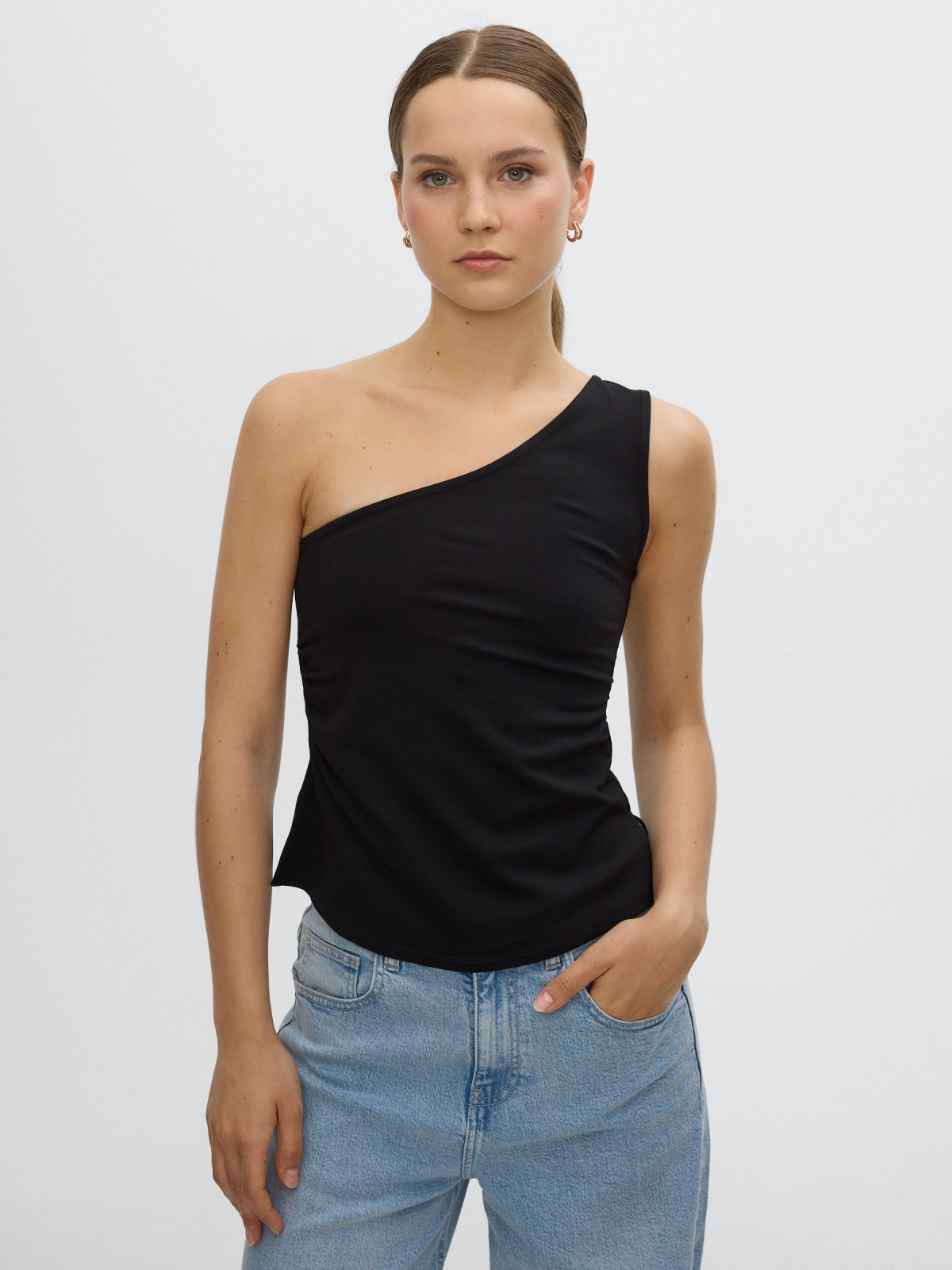 Slim asymmetrical draped top black middle front view