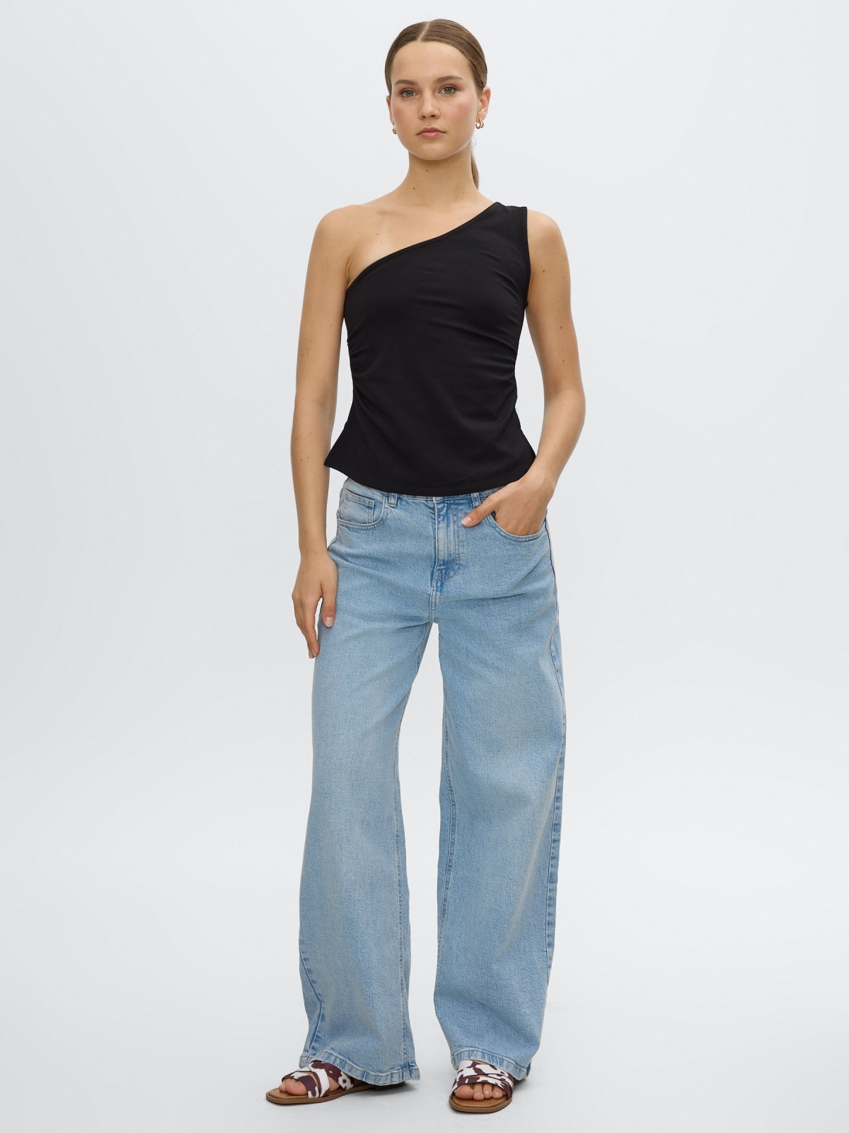 Slim asymmetrical draped top black front view