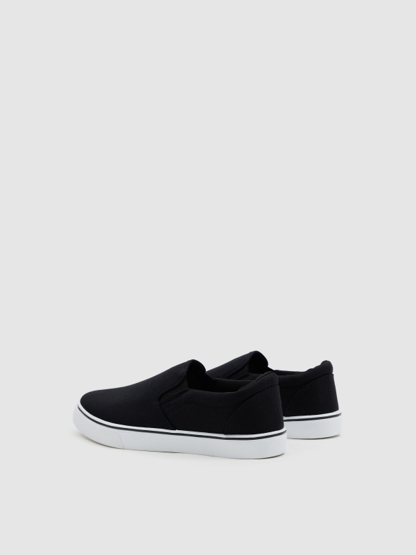 Zapatilla lona negra elásticos negro vista trasera 45º